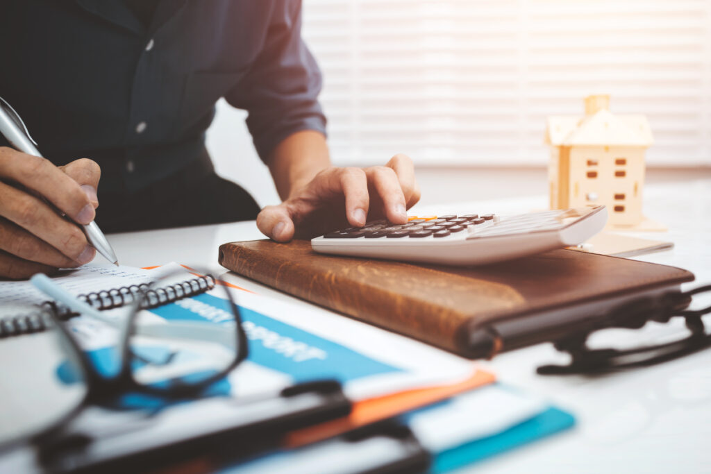 Business Man Accountant Using Calculator To Calculating Bugget